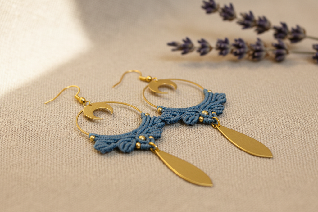 Boho Crescent Moon Dangle Earrings - Close-up on linen